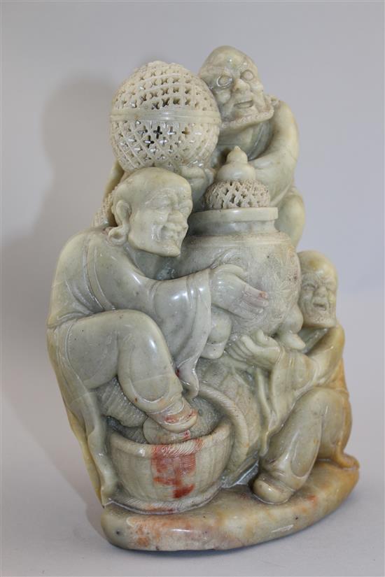 A Chinese soapstone group of three Luohan, 20th century, 22cm